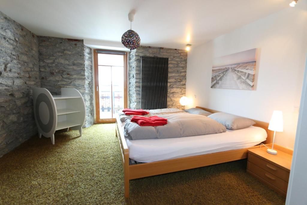 Postel nebo postele na pokoji v ubytování Stegmatte - Unique luxury triplex apartment for 10 persons