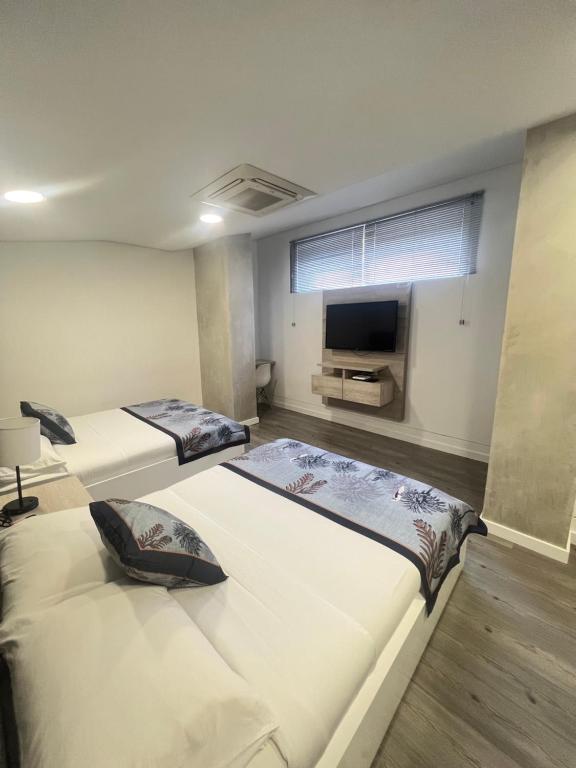 Postel nebo postele na pokoji v ubytování Edificio Lotus Loft