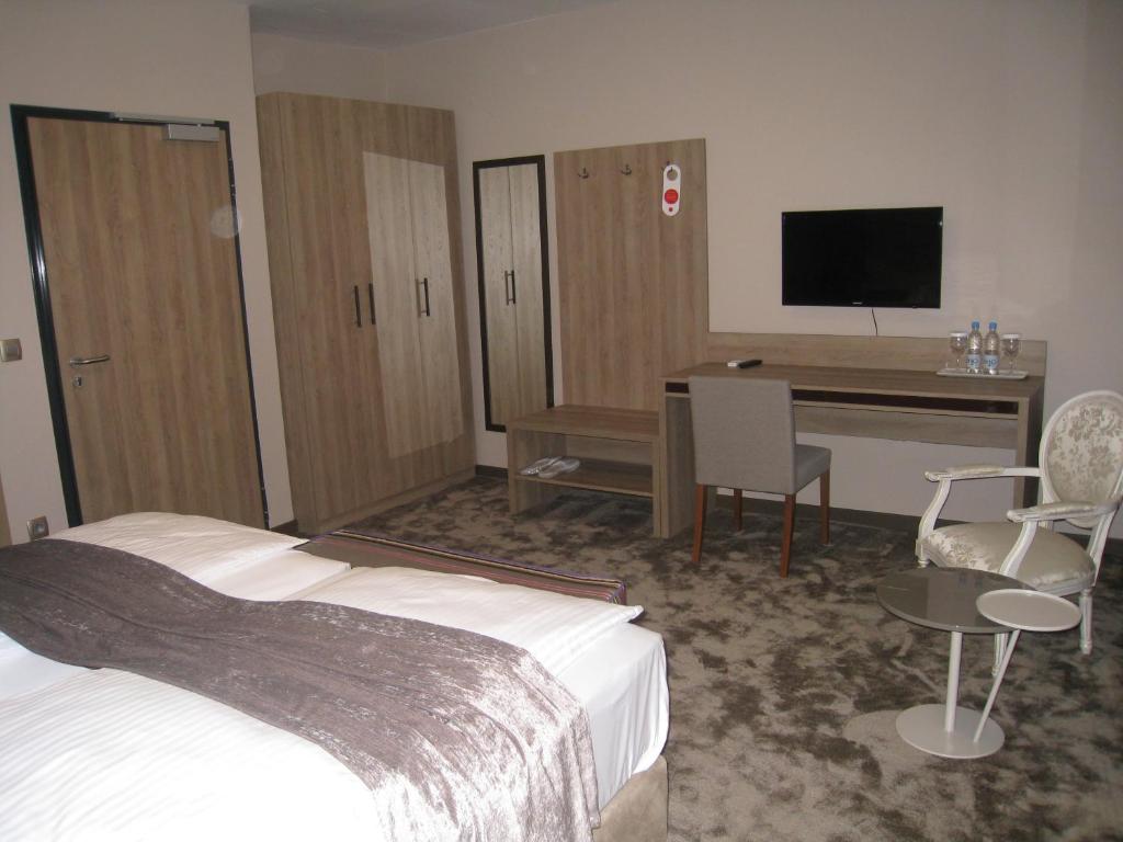 Postel nebo postele na pokoji v ubytování Hotel VIP