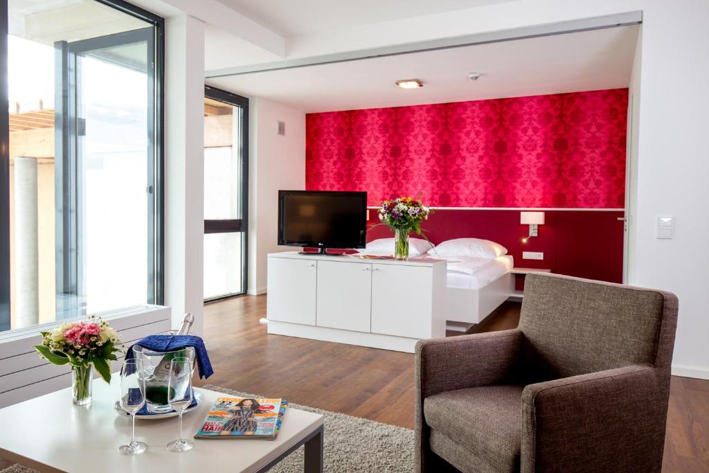 TV a/nebo společenská místnost v ubytování Carat Apartments Grömitz