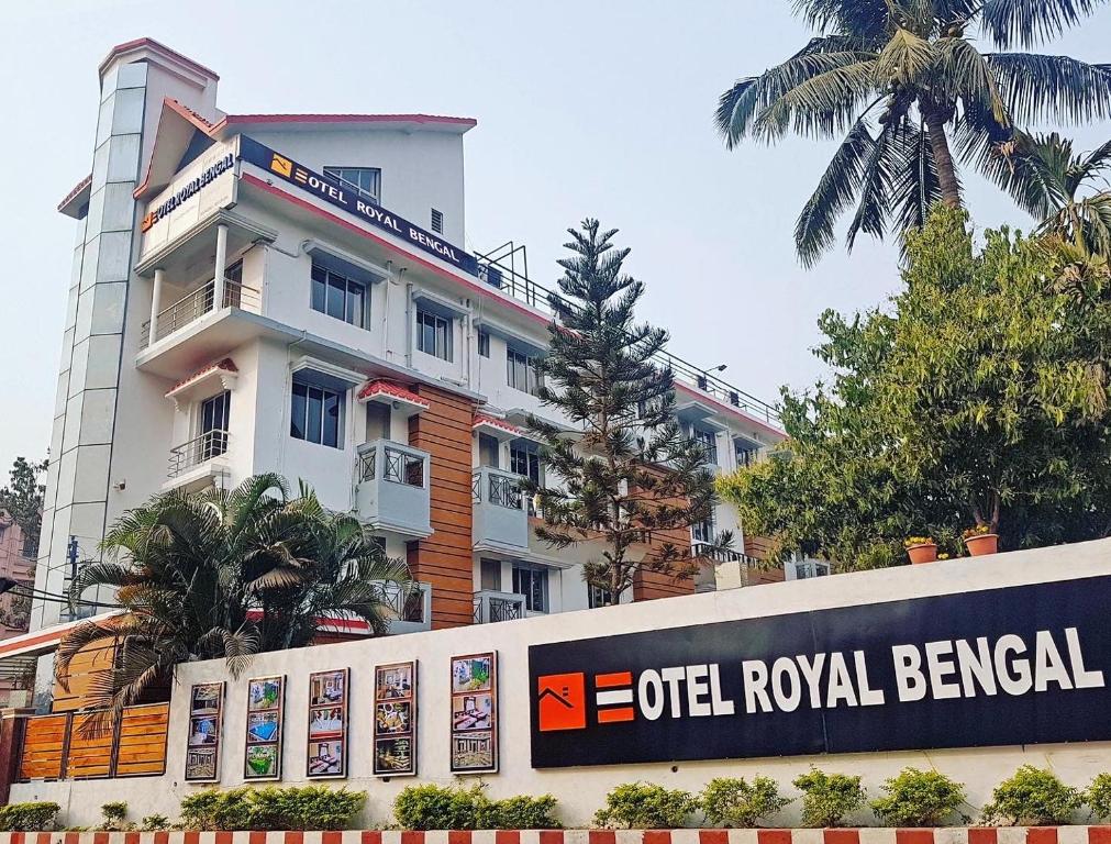 a building with a sign in front of it at Hotel Royal Bengal in Bolpur