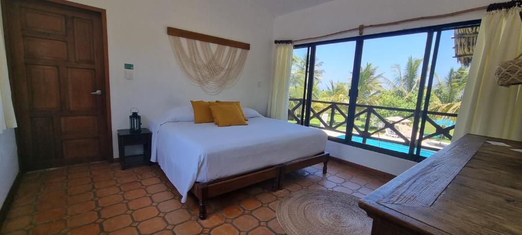 Postel nebo postele na pokoji v ubytování Hotel Taboga Eco Boutique & Spa Costa Esmeralda