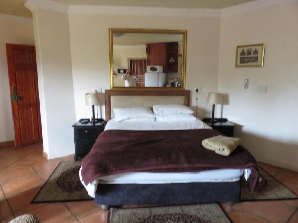 Postel nebo postele na pokoji v ubytování Harties Lodge - Meerhof Bay View 6