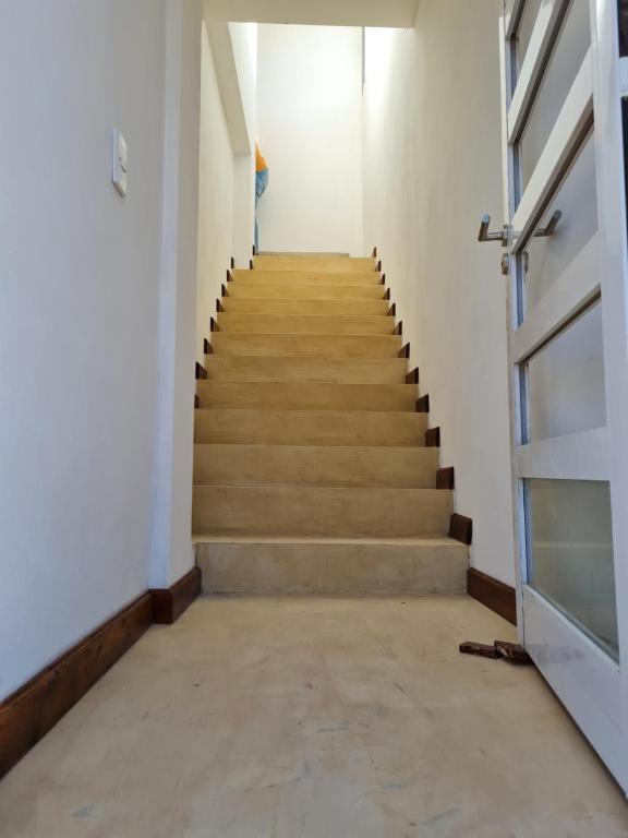 a hallway with a staircase in a building at Departamentos Mita Í in Isoquí