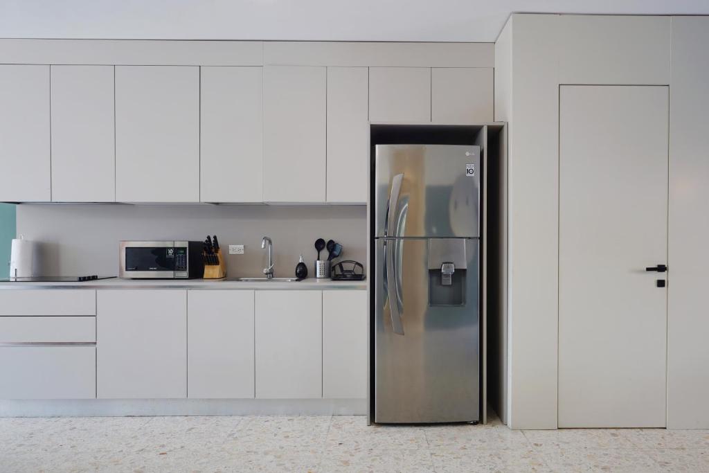 Kuchyň nebo kuchyňský kout v ubytování La Moderna by Wynwood House