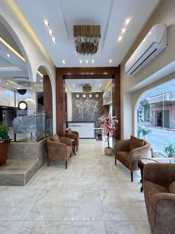 a lobby with chairs and a waiting room at El Mansour Hotel apartmen 74 in Mansoura