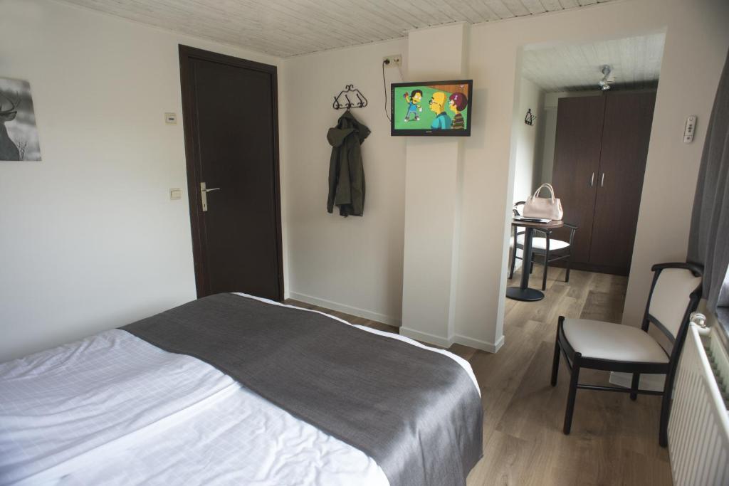 Postel nebo postele na pokoji v ubytování Hostellerie d'Inzepré