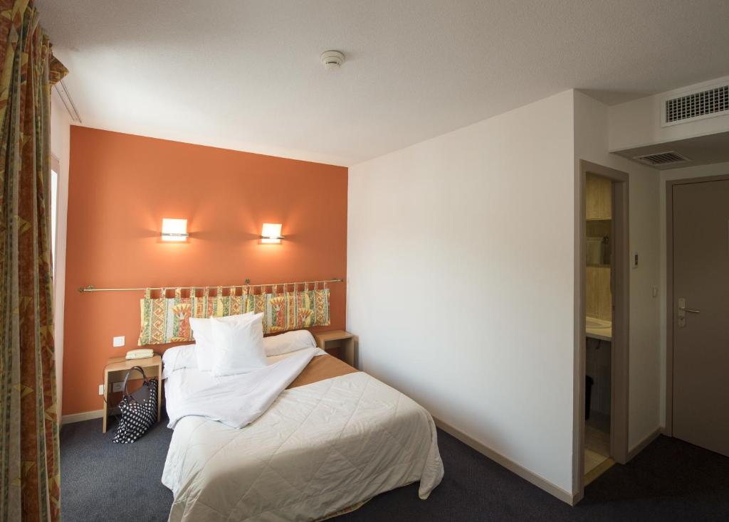 Postel nebo postele na pokoji v ubytování Hôtel Esplanade Eden