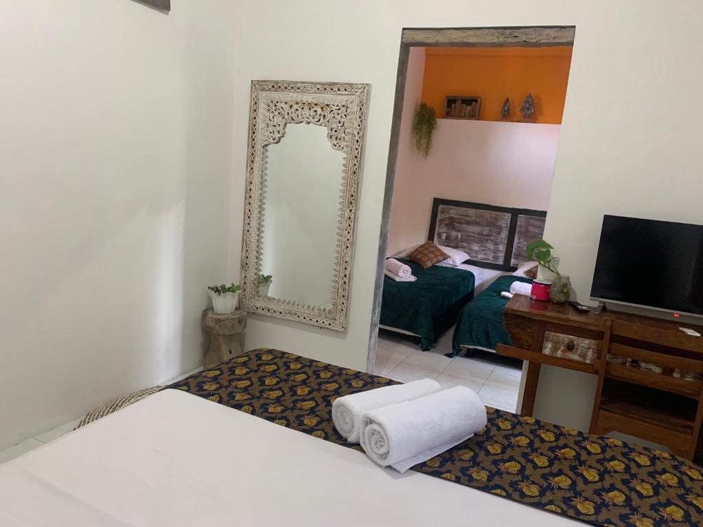 Postel nebo postele na pokoji v ubytování Nextdoor Rooms