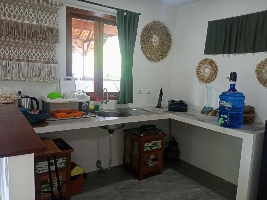 Kuchyň nebo kuchyňský kout v ubytování Hideaway Batukaras