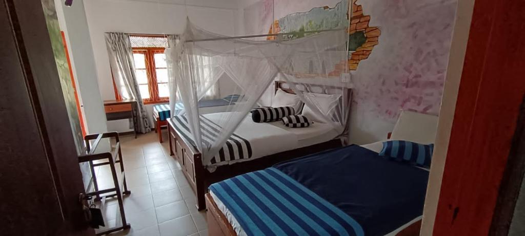 a bedroom with two bunk beds in a room at Iconic Rawana Resort in Ella
