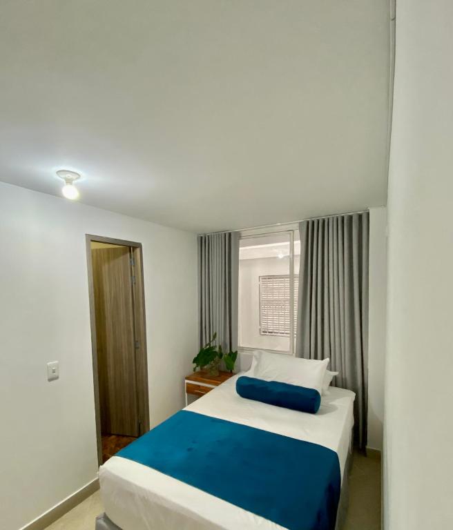 Postel nebo postele na pokoji v ubytování San Ignacio Hotel