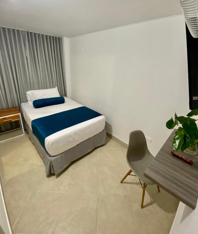 Postel nebo postele na pokoji v ubytování San Ignacio Hotel