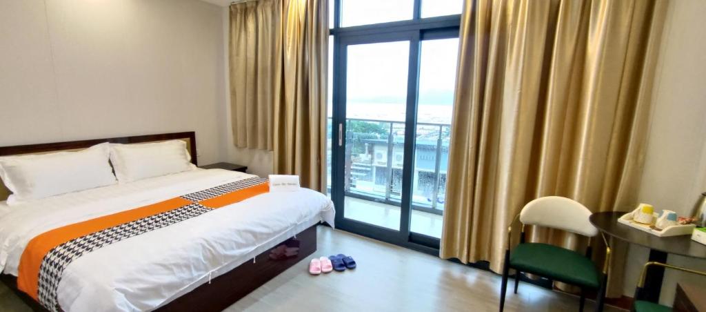 Postel nebo postele na pokoji v ubytování Sky Garden Hotel