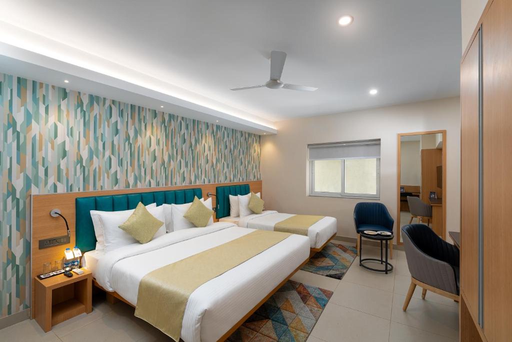 Postel nebo postele na pokoji v ubytování Cozzet Victoria Hotel
