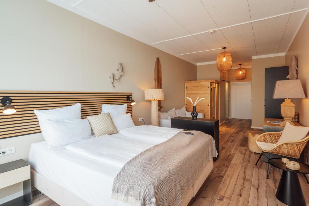 Postel nebo postele na pokoji v ubytování Aqua Hotel