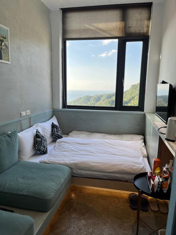 Postel nebo postele na pokoji v ubytování M Bar House