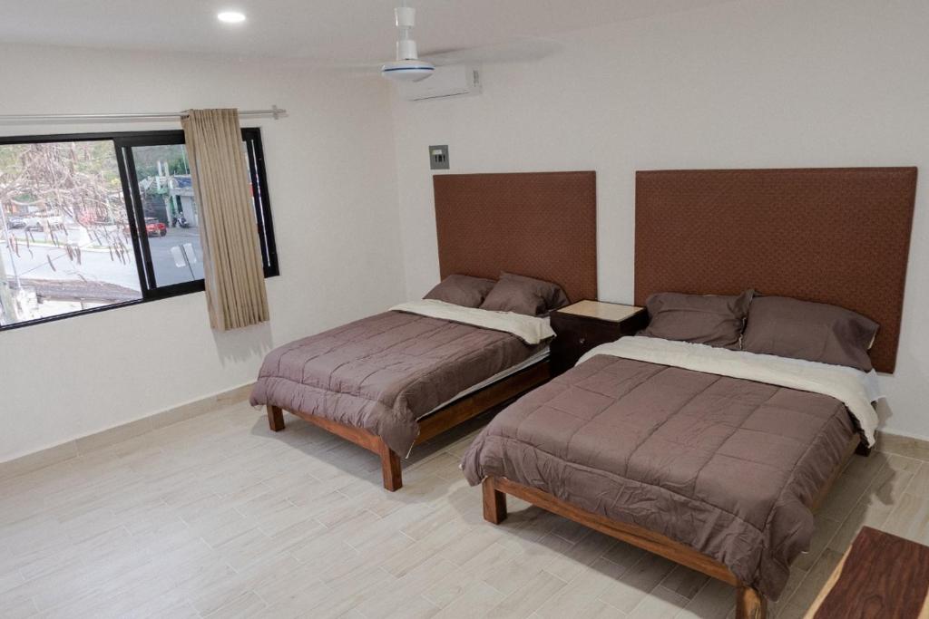 Postel nebo postele na pokoji v ubytování 3B Departamentos