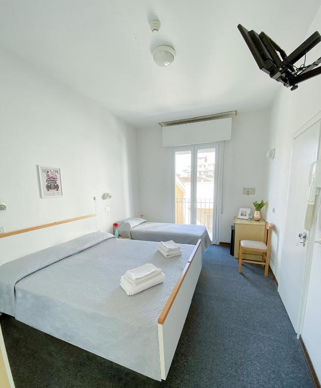 Postel nebo postele na pokoji v ubytování Hotel Berlino