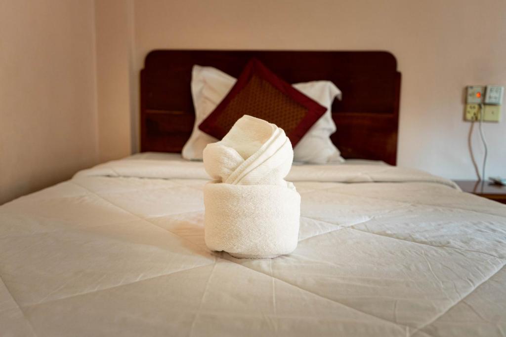 Postel nebo postele na pokoji v ubytování Nawin Palace Guesthouse