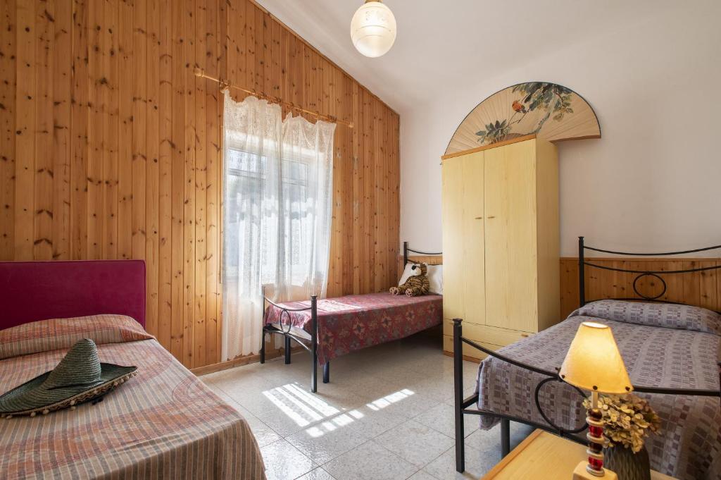 Postel nebo postele na pokoji v ubytování Appartamento Panoramico Isola Rossa