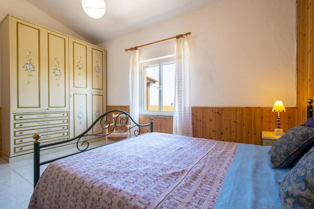 Postel nebo postele na pokoji v ubytování Appartamento Panoramico Isola Rossa