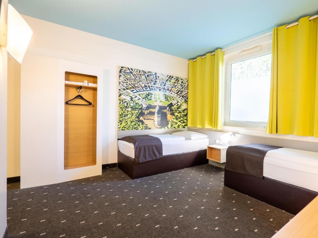 Postel nebo postele na pokoji v ubytování B&B Hotel Karlsruhe