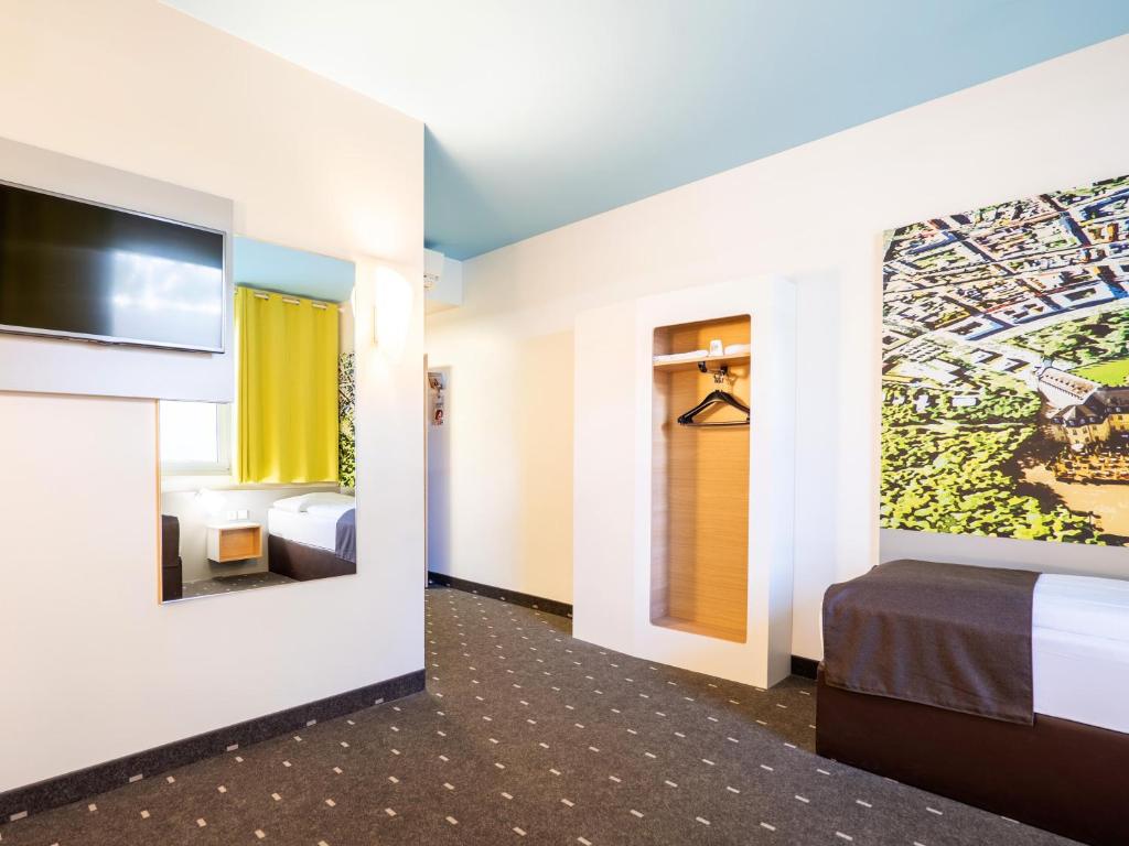 Postel nebo postele na pokoji v ubytování B&B Hotel Karlsruhe
