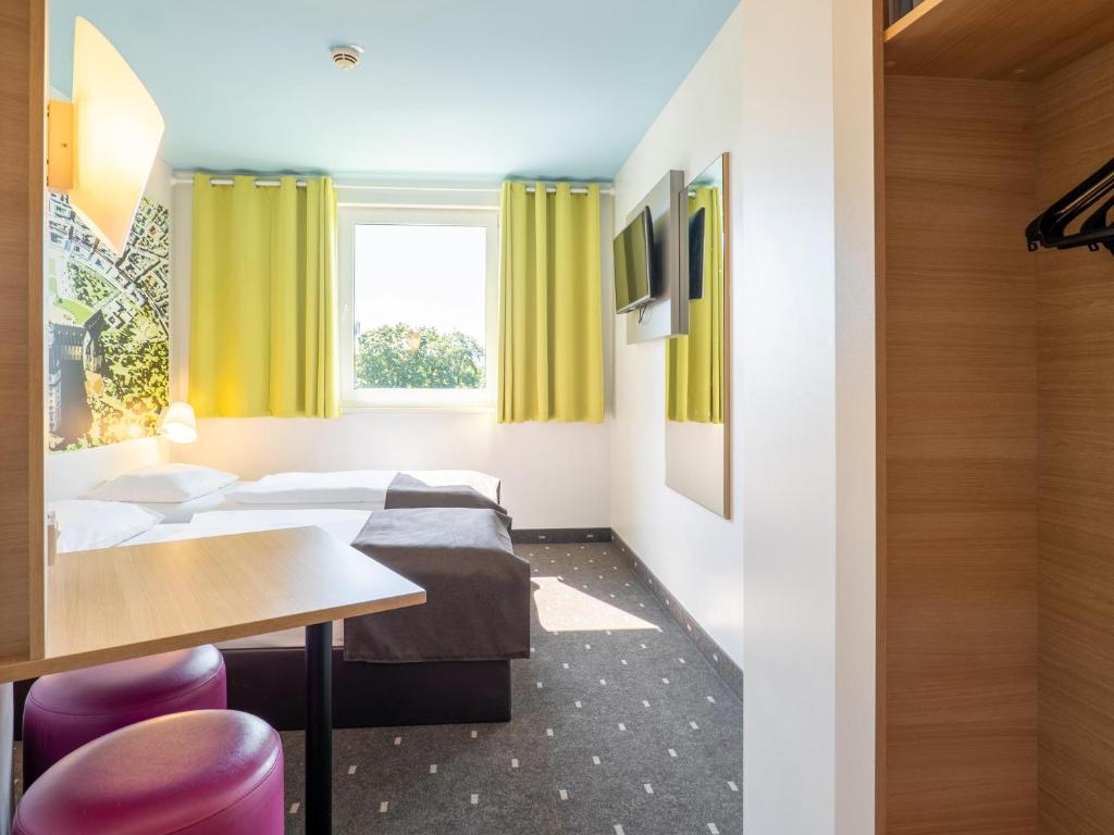 Postel nebo postele na pokoji v ubytování B&B Hotel Karlsruhe