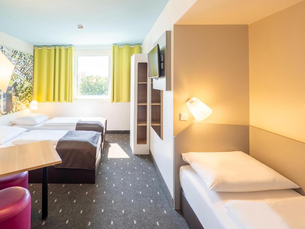 Postel nebo postele na pokoji v ubytování B&B Hotel Karlsruhe