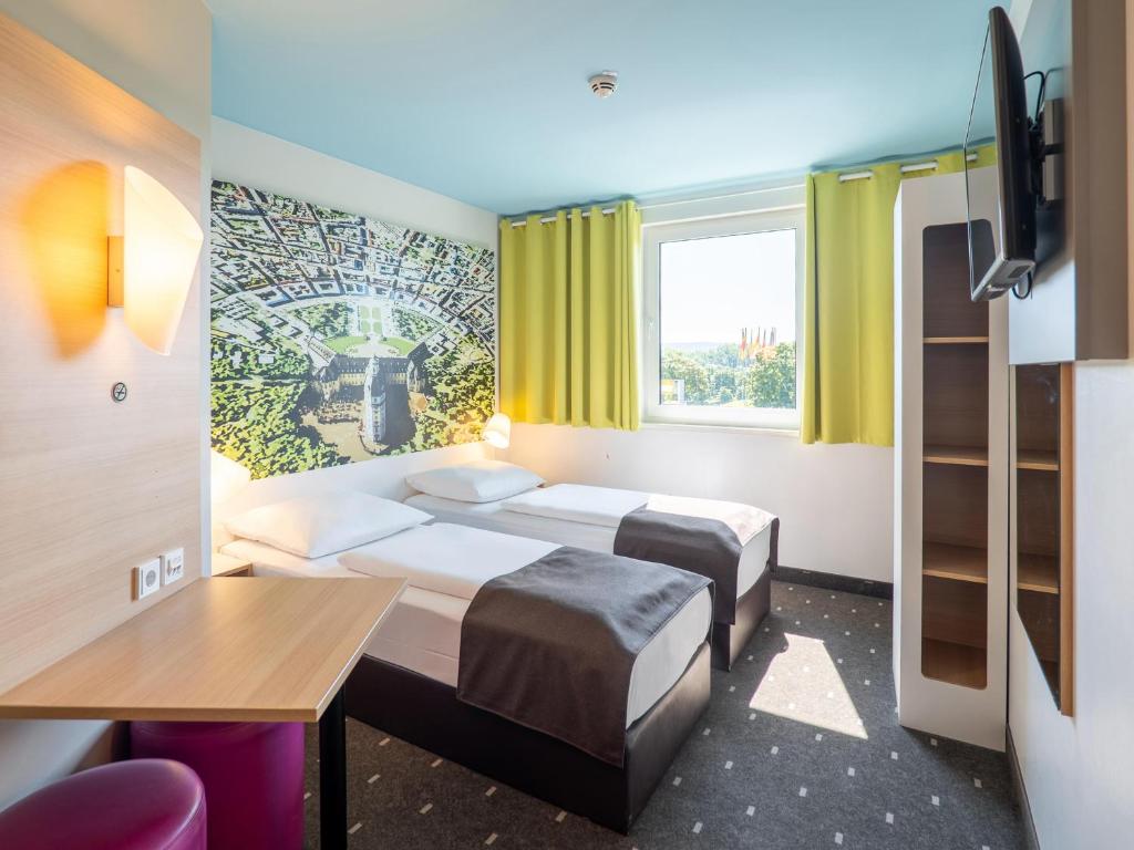 Postel nebo postele na pokoji v ubytování B&B Hotel Karlsruhe
