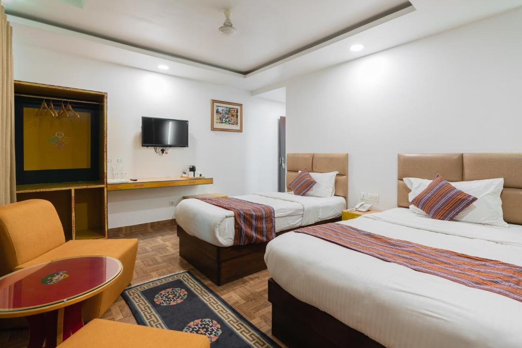 Postel nebo postele na pokoji v ubytování Hotel Ratnasambhava
