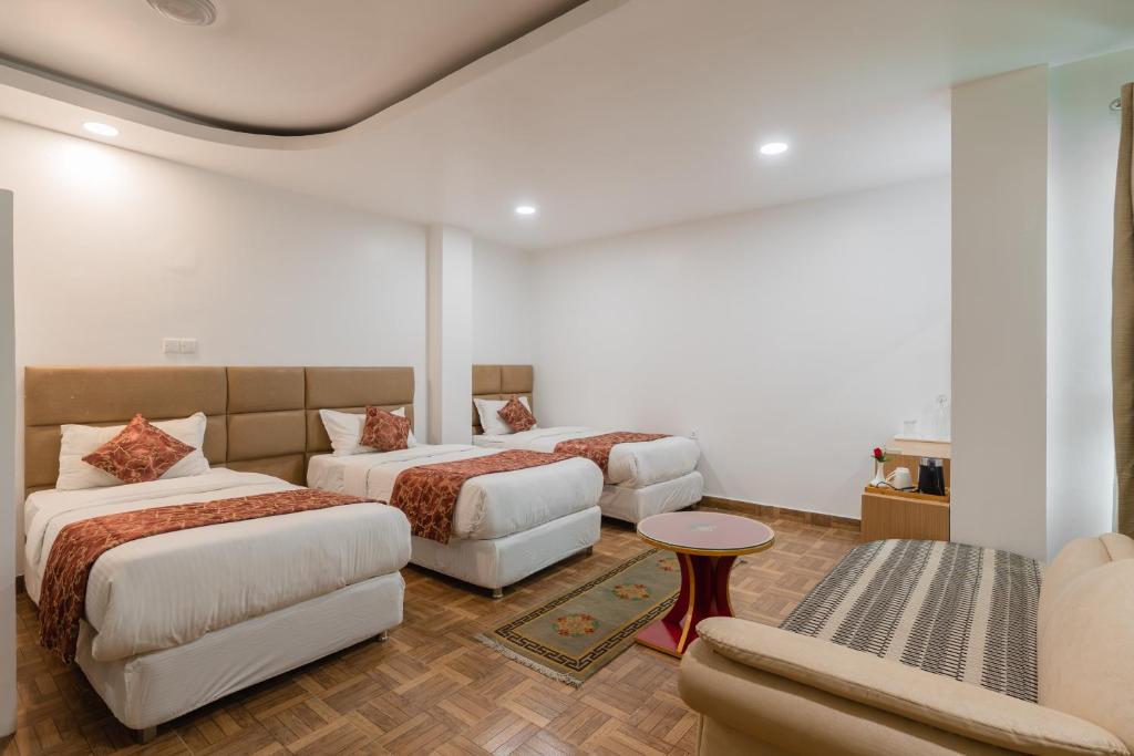 Postel nebo postele na pokoji v ubytování Hotel Ratnasambhava