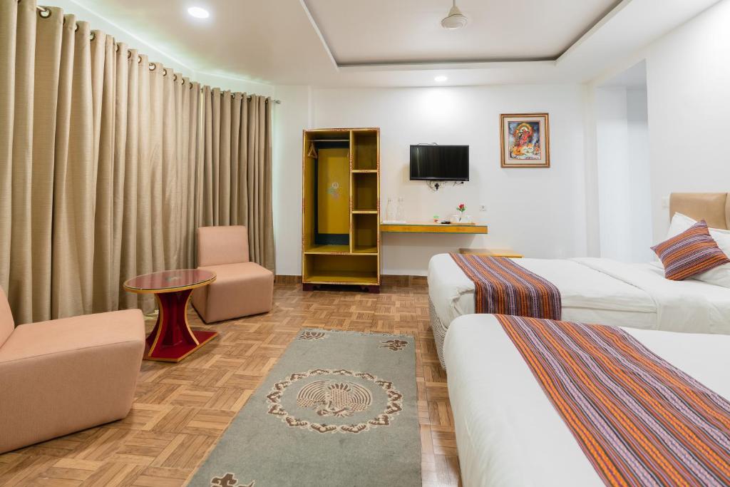 Postel nebo postele na pokoji v ubytování Hotel Ratnasambhava