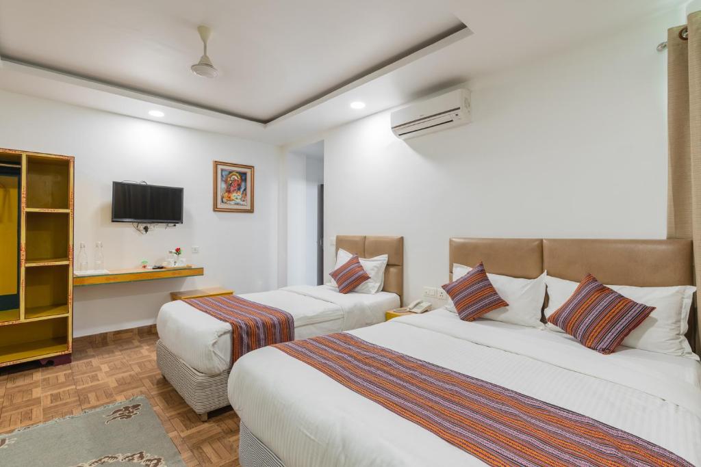 Postel nebo postele na pokoji v ubytování Hotel Ratnasambhava