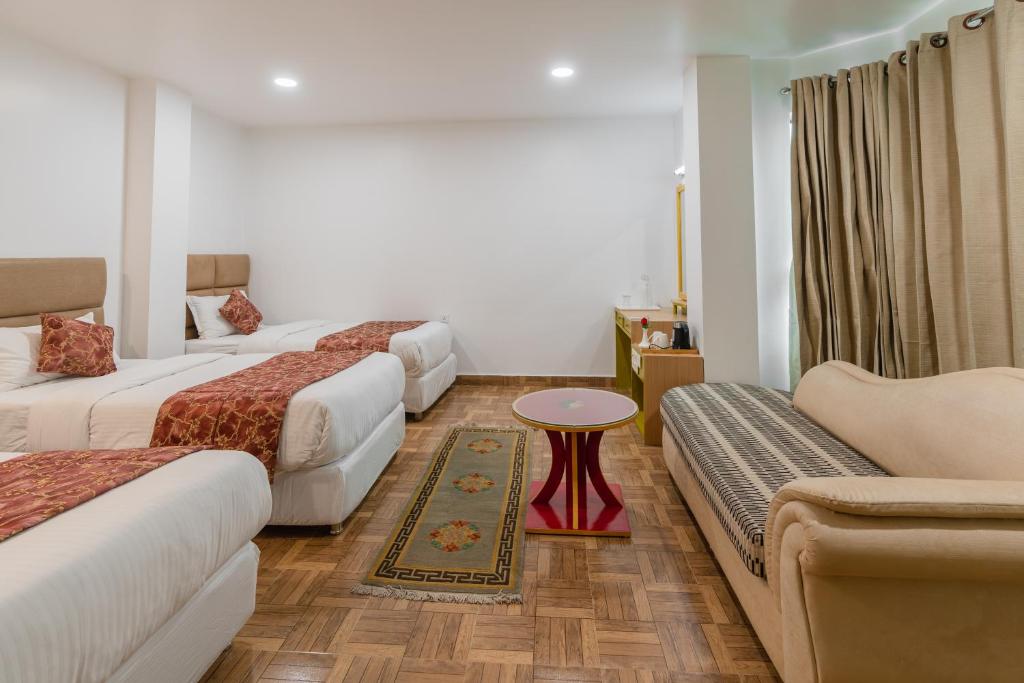 Postel nebo postele na pokoji v ubytování Hotel Ratnasambhava