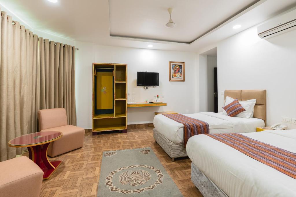 Postel nebo postele na pokoji v ubytování Hotel Ratnasambhava