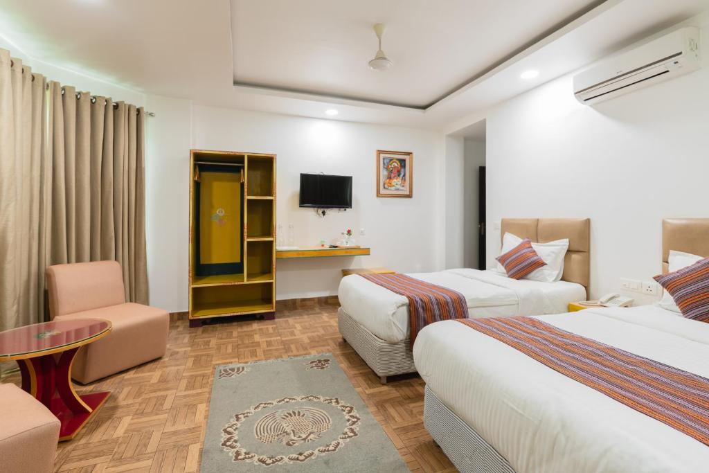 Postel nebo postele na pokoji v ubytování Hotel Ratnasambhava