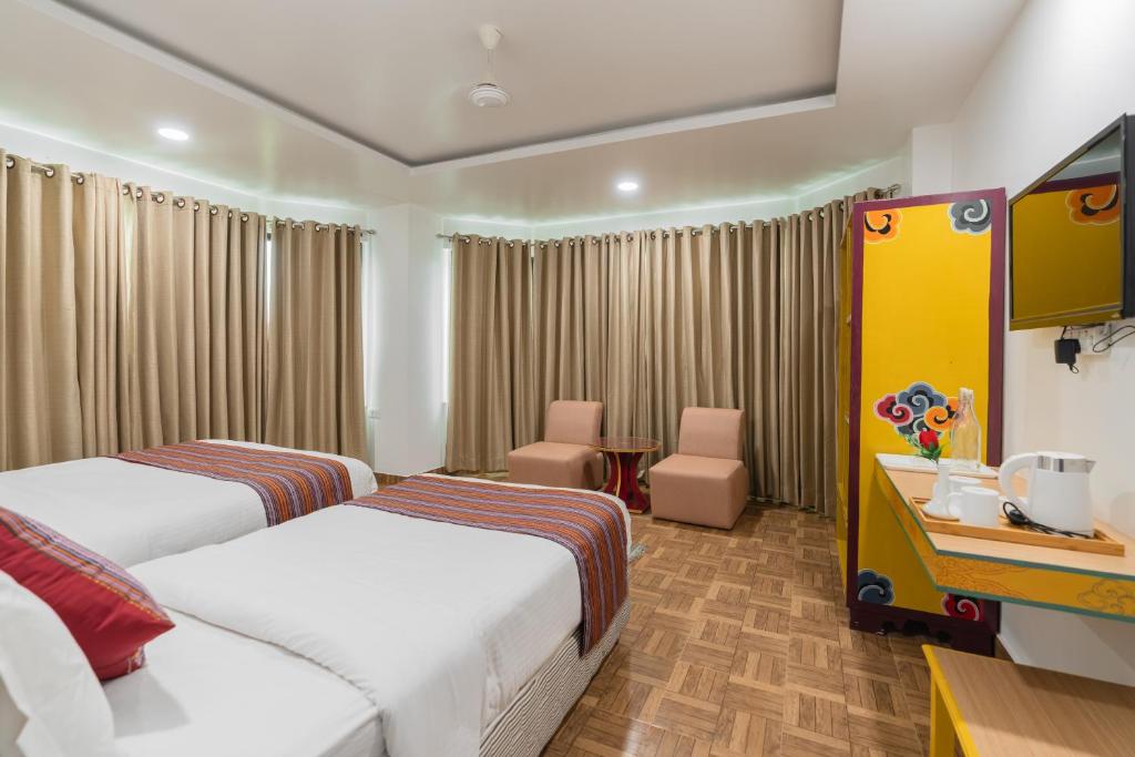 Postel nebo postele na pokoji v ubytování Hotel Ratnasambhava