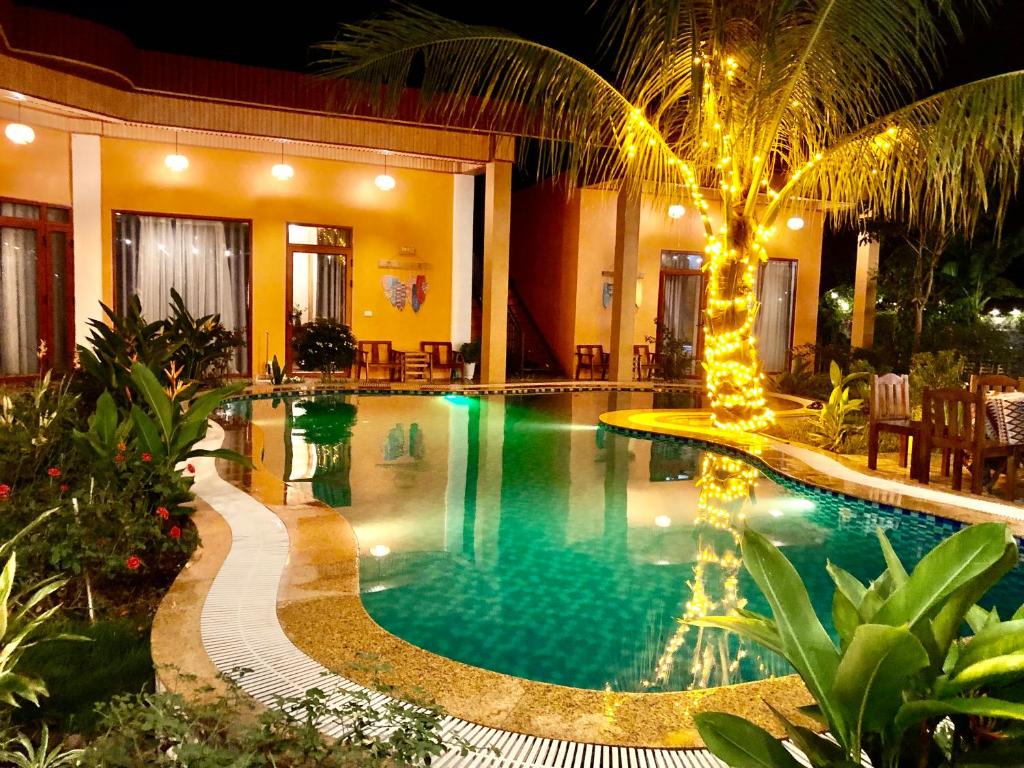 a swimming pool in a house with a resort at Rosa Garden in Ninh Binh