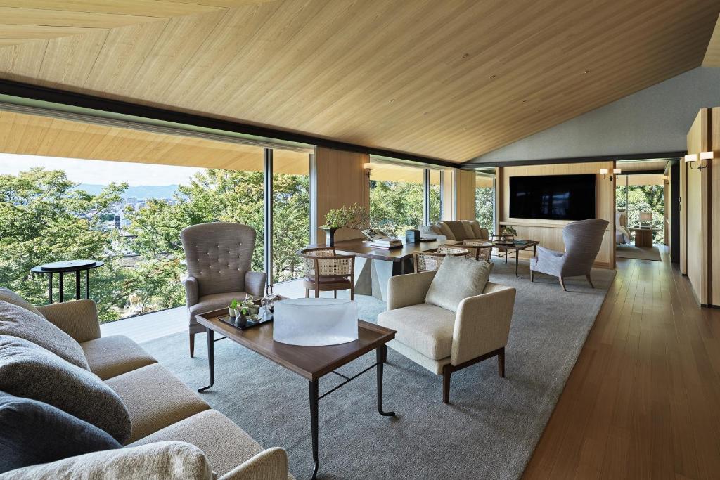 a living room with a couch and a table at Park Hyatt Kyoto in Kyoto