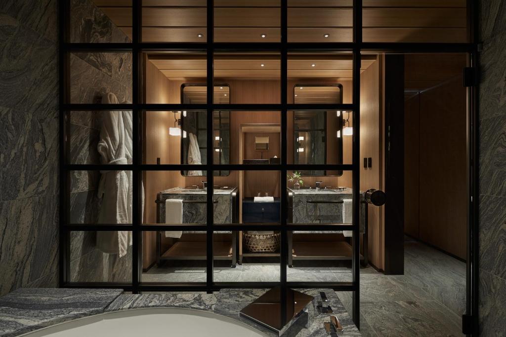 a room with a large glass window in a building at Park Hyatt Kyoto in Kyoto