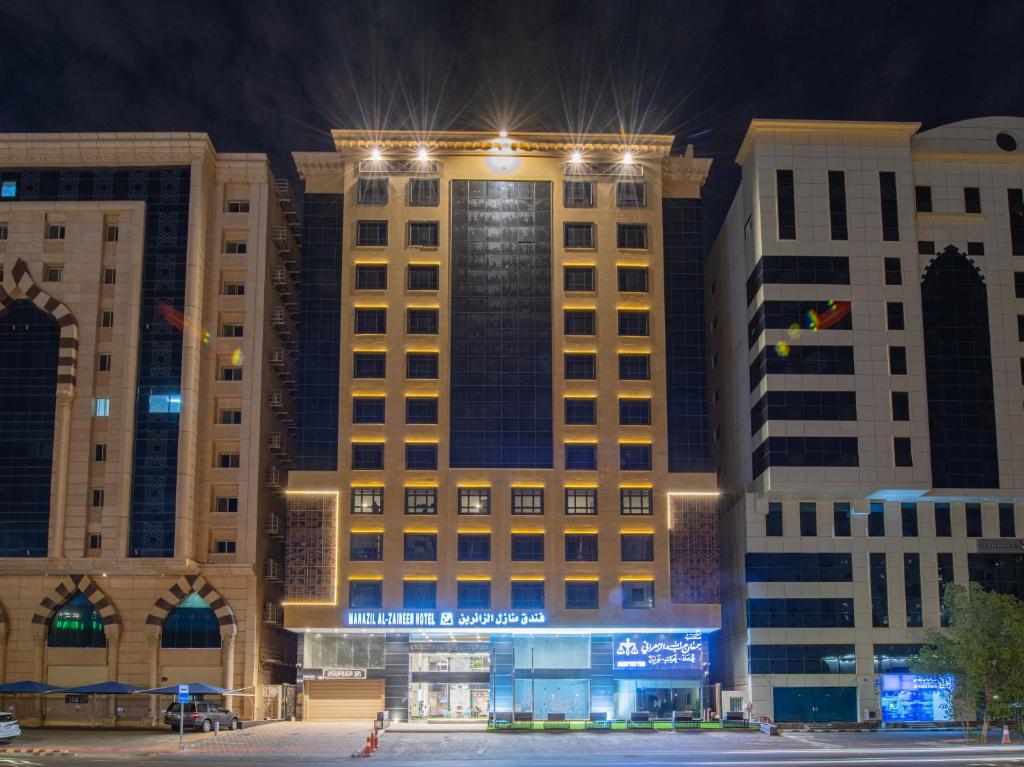 a large building with lights on top of it at Manazel Al Zaireen Hotel in Makkah
