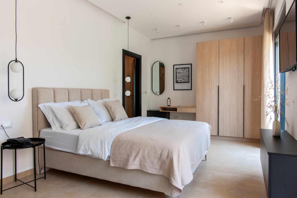 Postel nebo postele na pokoji v ubytování Soho Suites