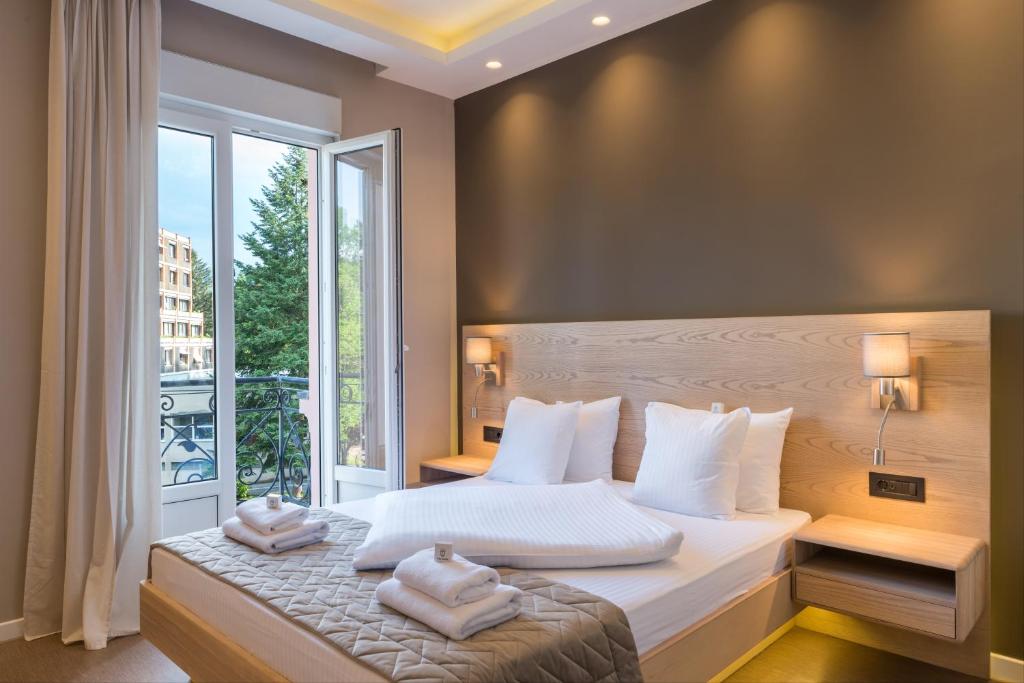 Postel nebo postele na pokoji v ubytování Emilia Lux Rooms