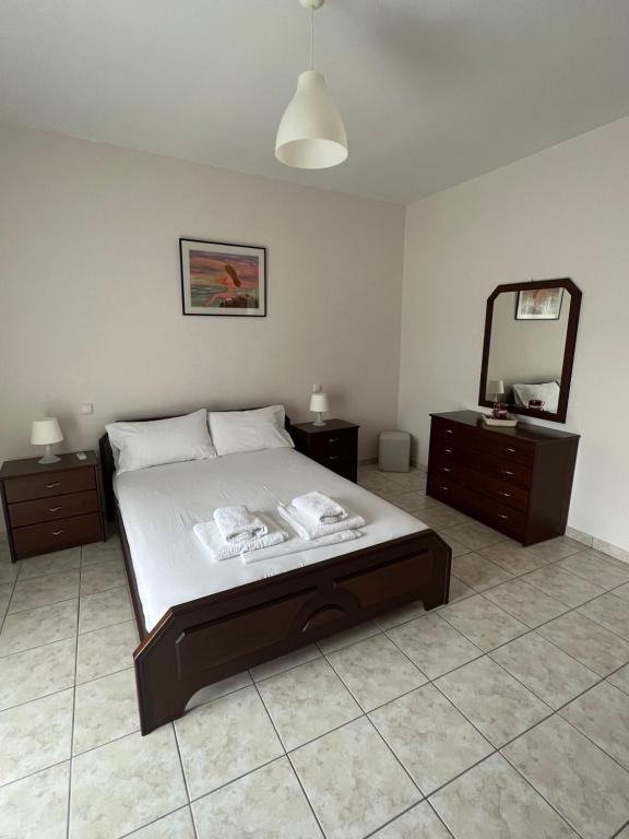Postel nebo postele na pokoji v ubytování Alexandra' s Apartments