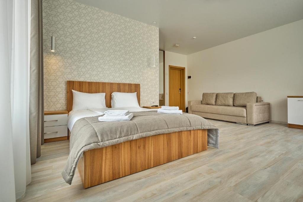 Postel nebo postele na pokoji v ubytování Готель У Борисовича & SPA
