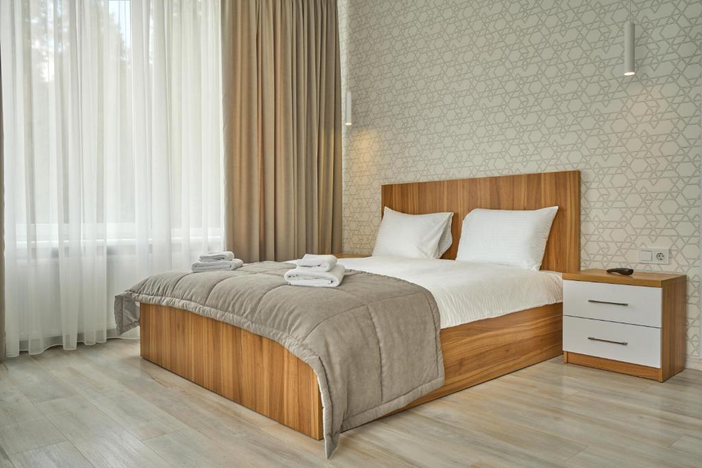 Postel nebo postele na pokoji v ubytování Готель У Борисовича & SPA