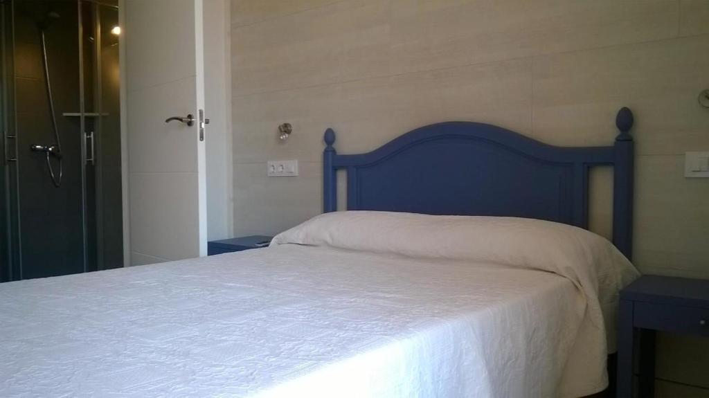 Postel nebo postele na pokoji v ubytování Hostal Paris Ciutadella