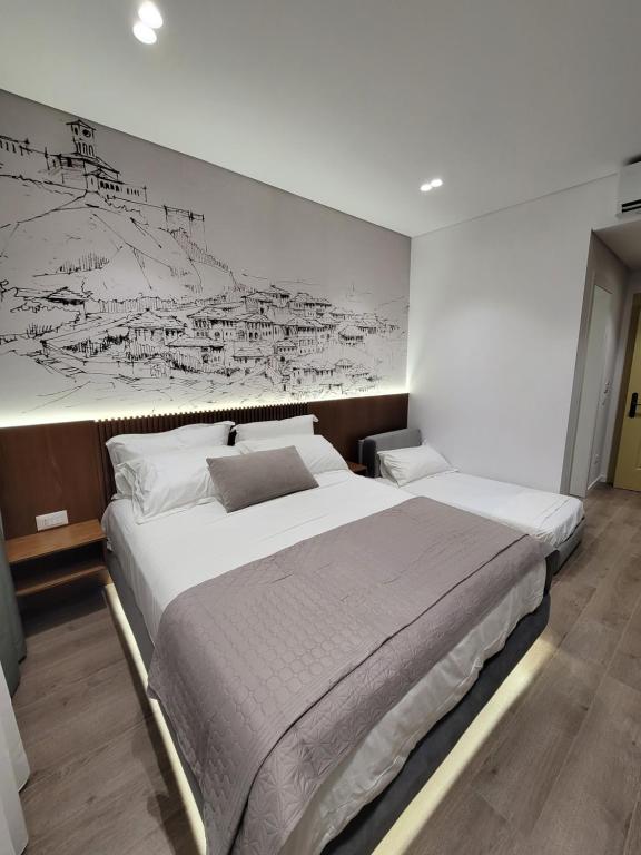 Postel nebo postele na pokoji v ubytování Jani Studio Apartments